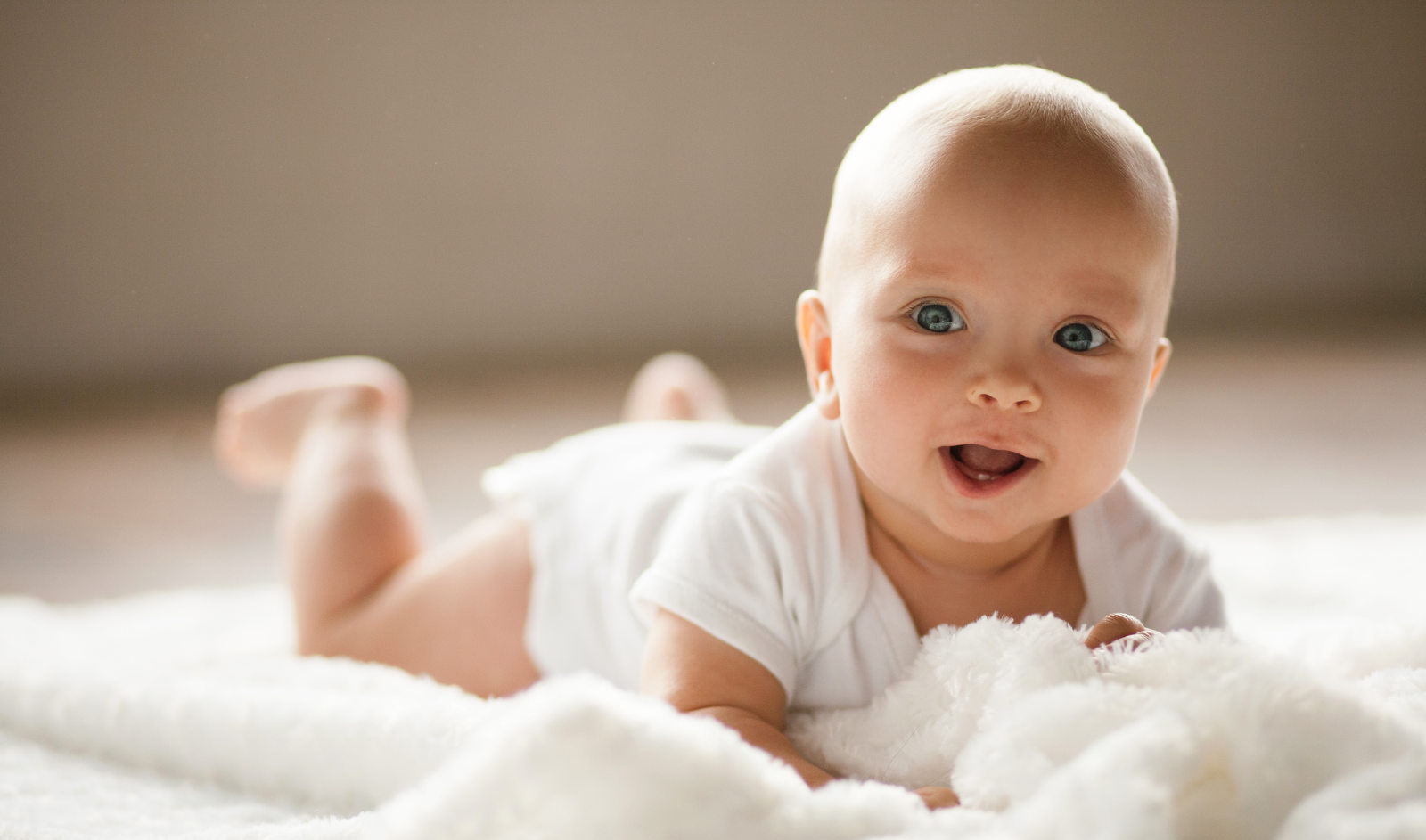 Portrait of small smiling baby.
